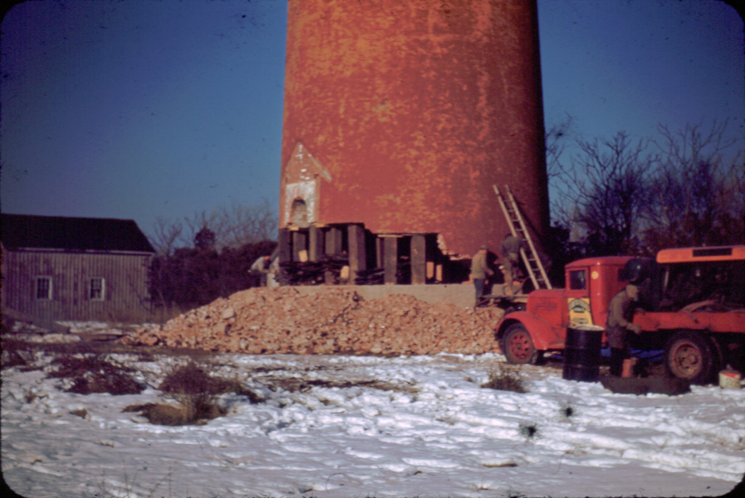 It took the Vim Demolition and Salvage Company two weeks to break through the concrete and brick to get to the pine timber that served as the lighthouse’s frame, then logs and brush were packed into the hole, soaked with gasoline and ignited.