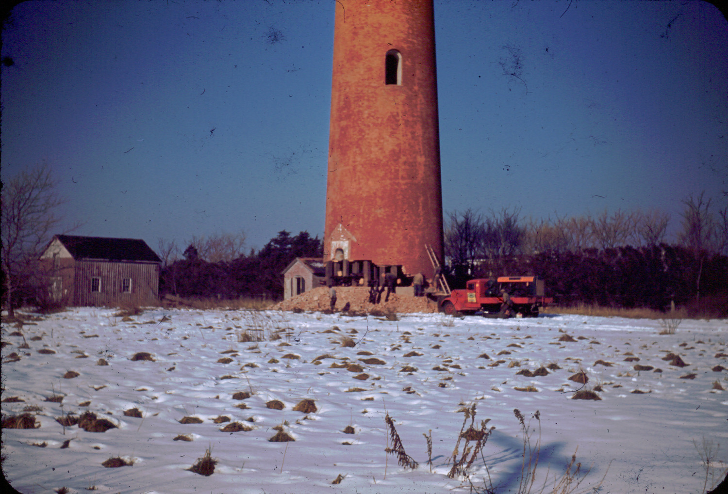 It took the Vim Demolition and Salvage Company two weeks to break through the concrete and brick to get to the pine timber that served as the lighthouse’s frame, then logs and brush were packed into the hole, soaked with gasoline and ignited.