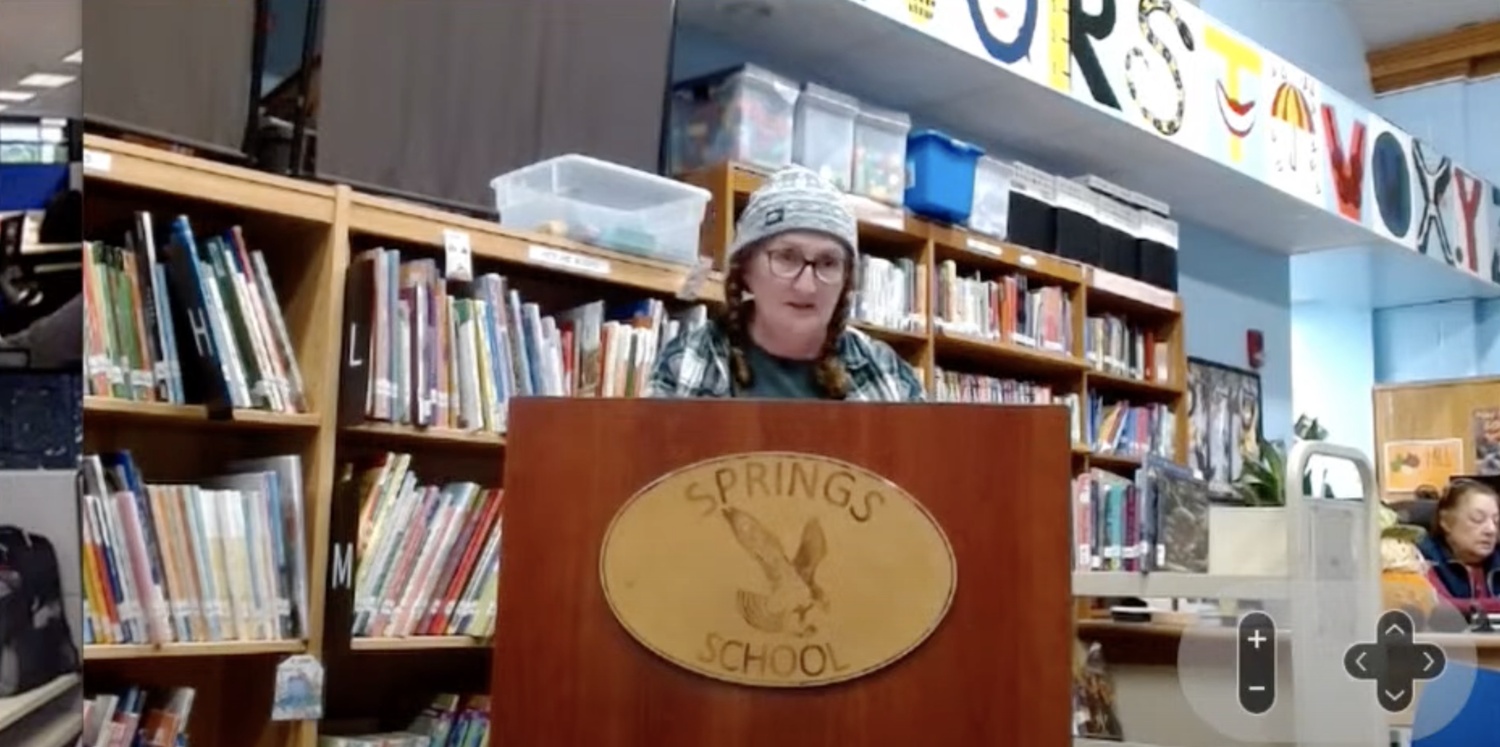 Springs School teaching assistant Margaret Doyle clarifies starting salaries for teaching assistants and paraprofessionals during Tuesday night's board of education meeting.