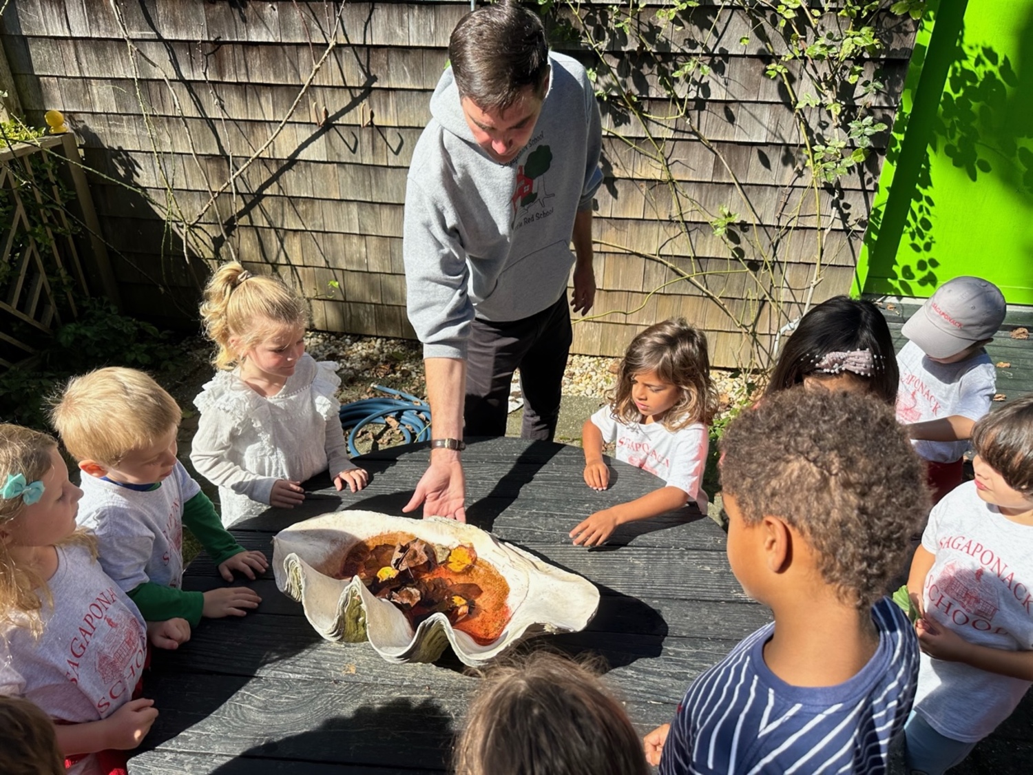 Students at Sagaponack School got a hands on lesson at the Madoo Conservancy, where teacher Scammell showed them a giant shell. COURTESY SAGAPONACK SCHOOL