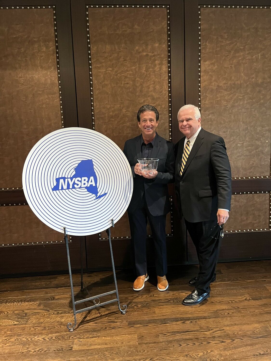 WLNG Radio station owner Bill Evans recently accepted the Broadcast Excellence Award for Public Service from the New York State Broadcasters Association. The award was for WLNG’s dedication to finding lost dogs and cats and all kinds of animals with WLNG’s “Pet Patrol.” COURTESY WLNG