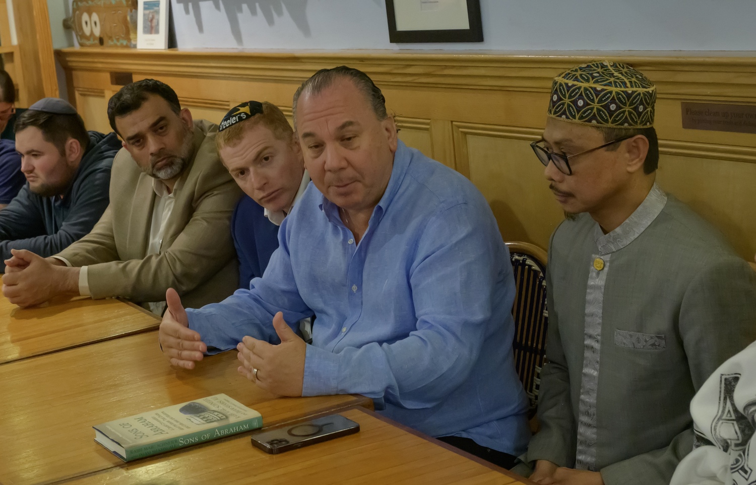 Rabbi Marc Schneier of Hampton Synagogue and Imam Shamsi Ali of the Jamaican Muslim Center in Queens met with 30 Jewish student leaders over the weekend at Beach Bakery in Westhampton Beach to discuss ways to combat hatred, violence and anti-Semitism that has been on the rise against the backdrop of the war in Gaza. RICK SEIGLEMAN