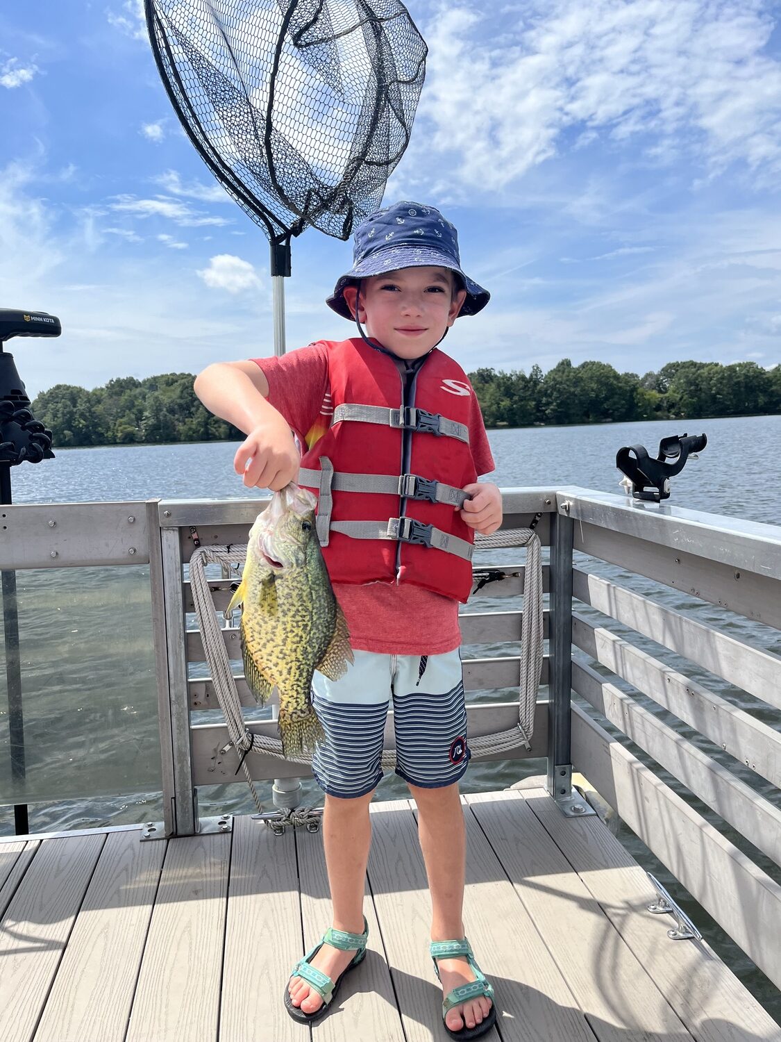 Aleksei Darvin with a beauty of a crappie caught on a trip to the Connecticut woods with his family this summer.  TANYA PACHECO