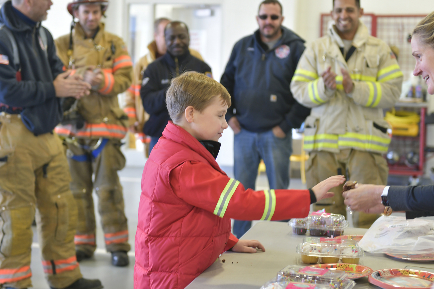 Southampton Fire Department firefighter help Rowland Egerton-Warburton celebrate his first ever birthday party on November 15.    DANA SHAW