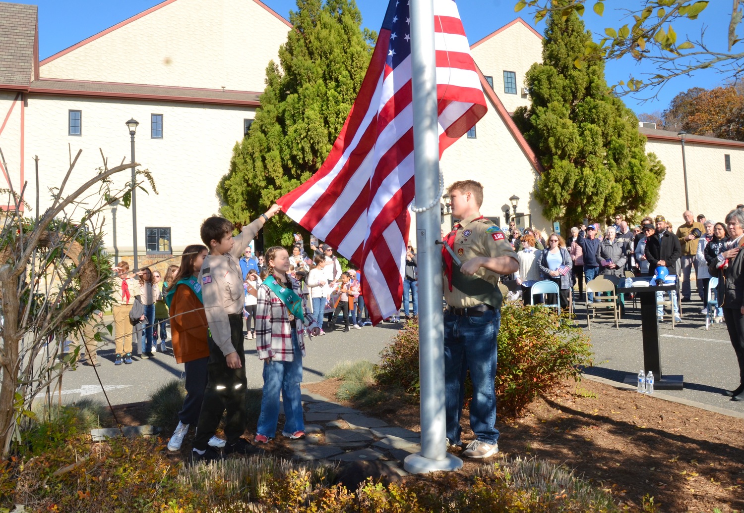 Scouts raise the flag at the The Montauk Playhouse Community Center Foundation's annual Veterans Day Flag Raising Ceremony on Saturday.  KYRIL BROMLEY