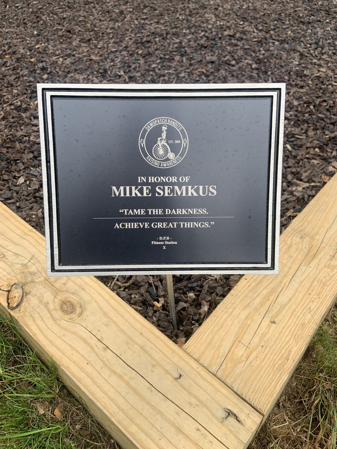 A plaque dedicating the workout station at Phoenix House to the memory of Mike Semkus. STEPHEN J. KOTZ
