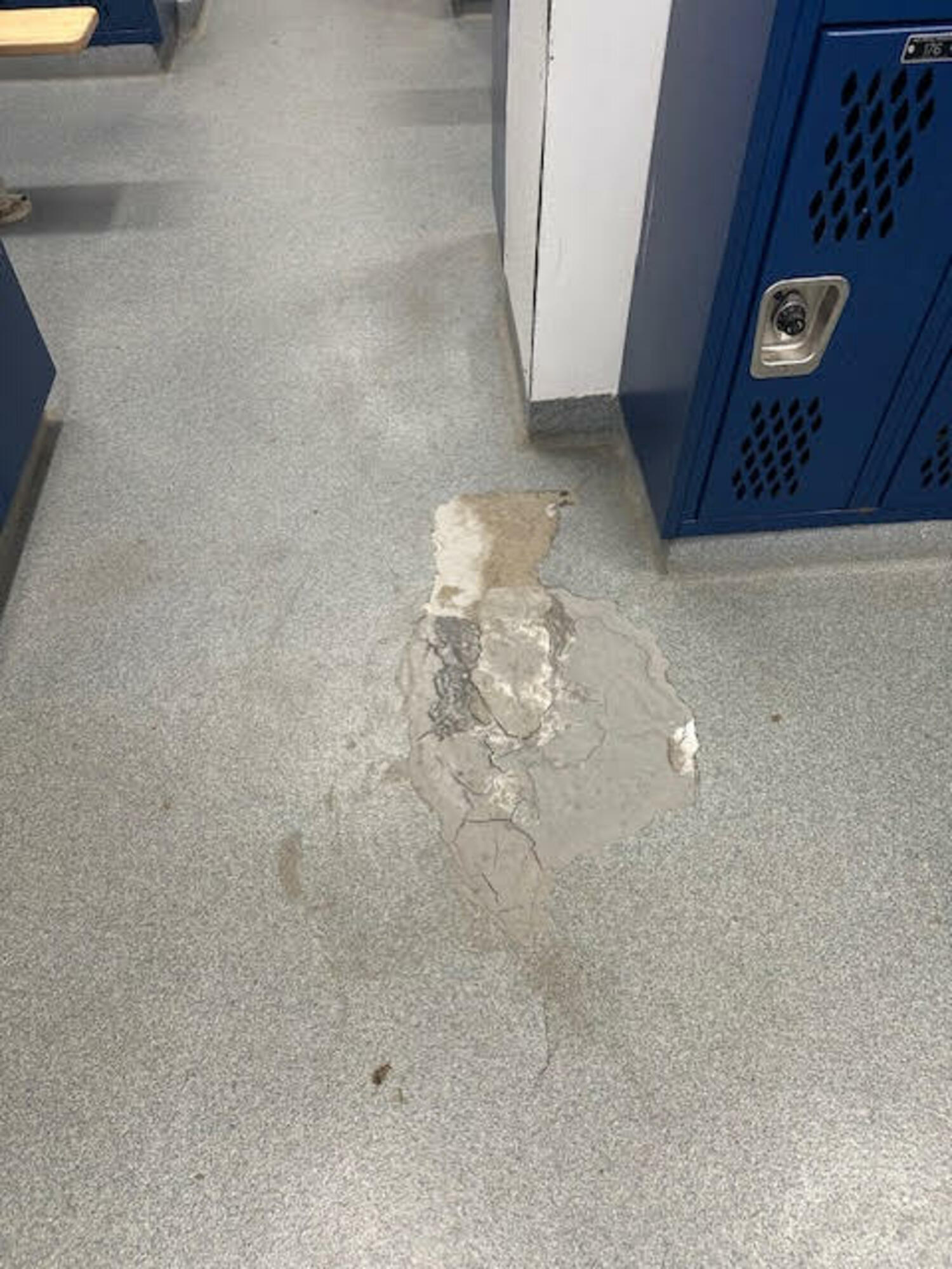 East Hampton Middle School locker room flooring is cracked and has been patched beyond repair. EAST HAMPTON SCHOOL DISTRICT