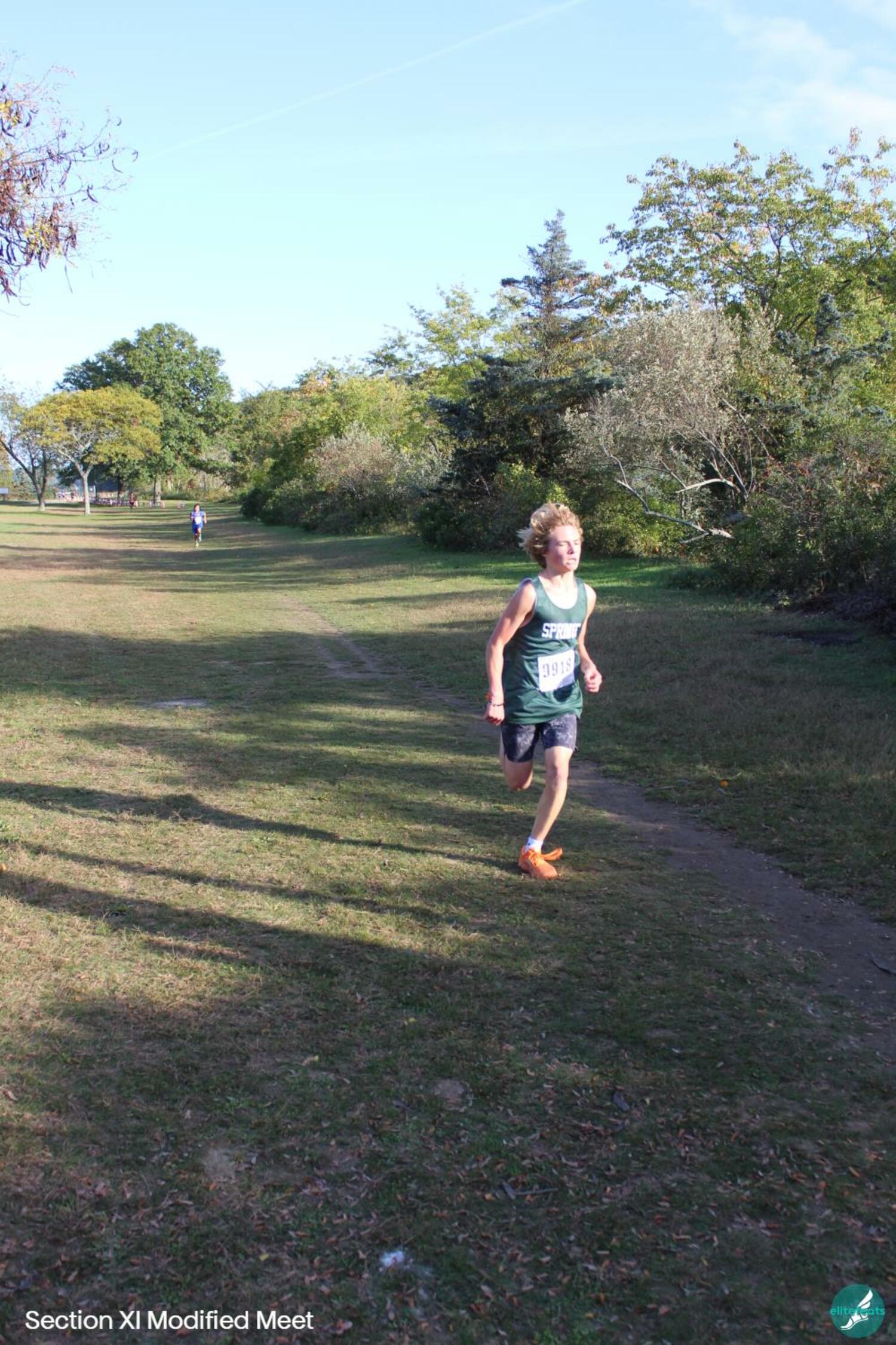 Jasper Samuelson crossing the finish line at the Sunken meadow invitational meet. Samuelson won first overall in the boys race, and broke the race time record, a whopping 8:33.