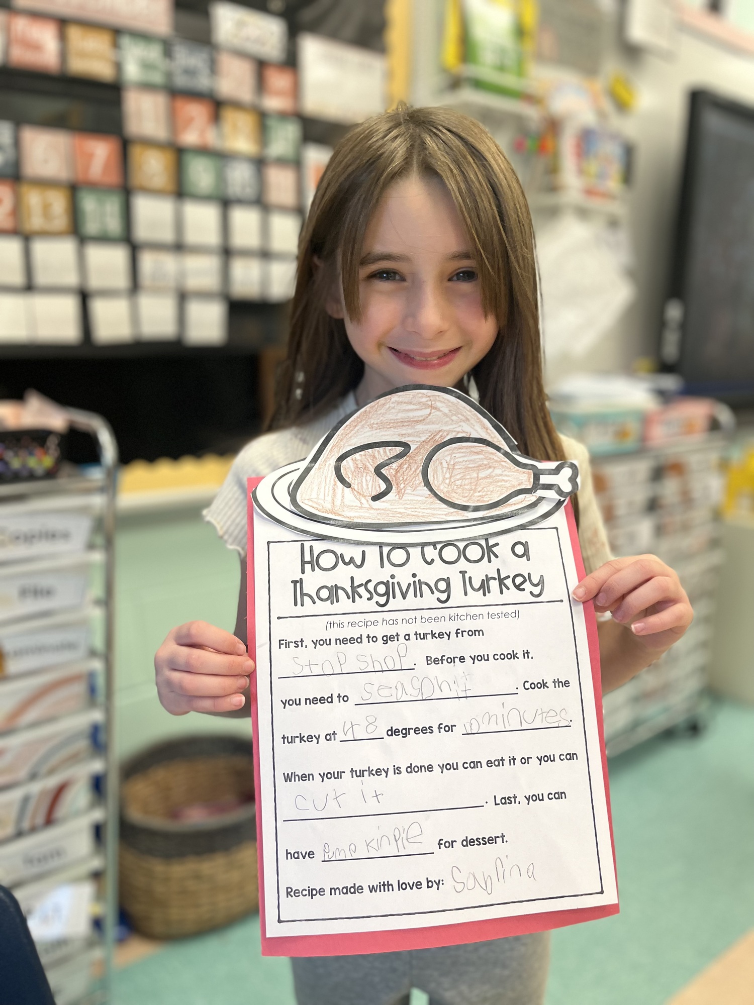 Sabrina Lattanzio, a second-grader in Erin McDermott’s class at Hampton Bays Elementary School is among the students who have been working on skills related to sequencing events and instructional writing pieces. As part of the unit of study, the students created their own turkey recipe and discussed the steps needed to create the perfect Thanksgiving bird. “Students really enjoyed creating their own silly yet delicious recipes,” said McDermott. COURTESY HAMPTON BAYS SCHOOL DISTRICT
