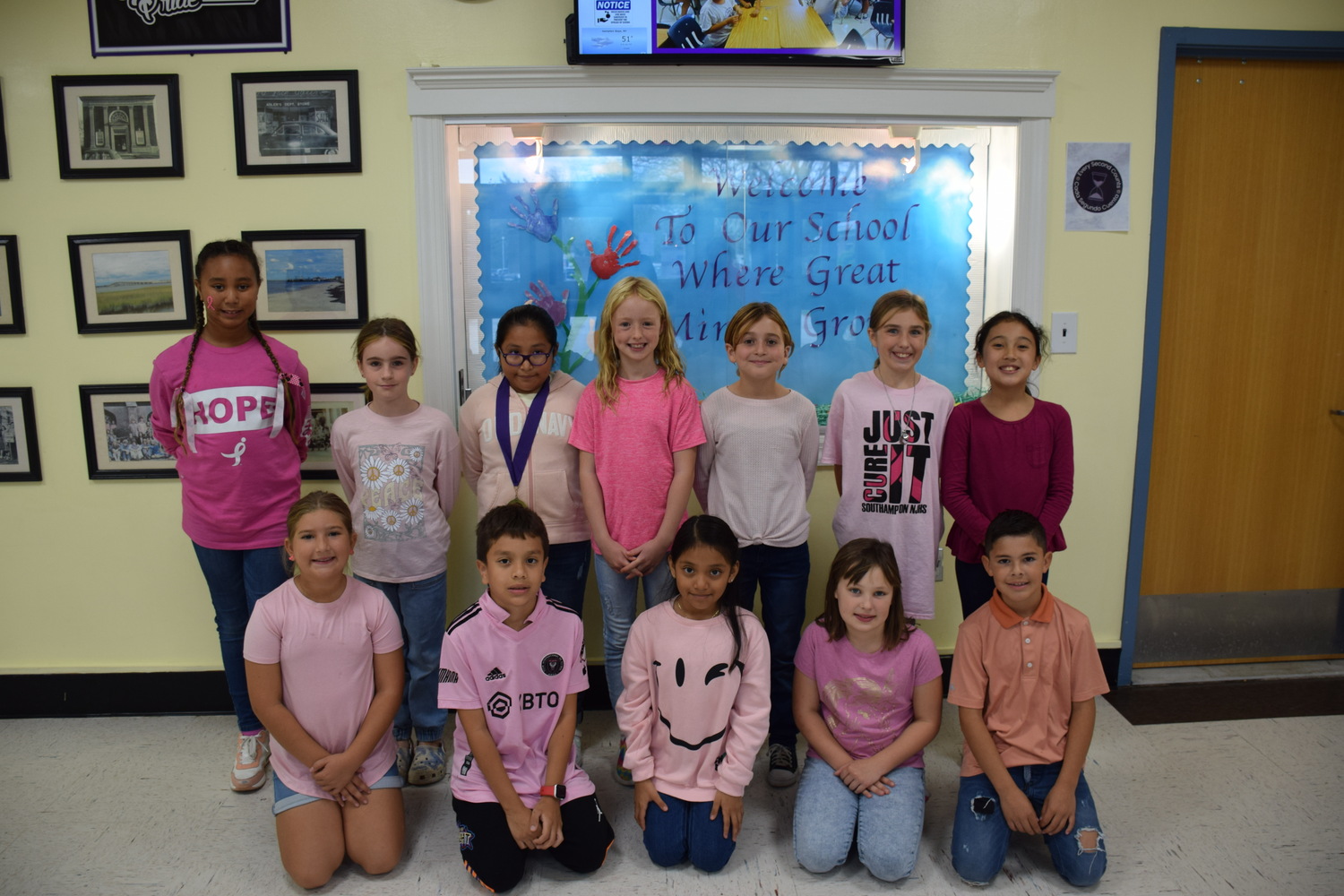 Members of the Hampton Bays Elementary School K-Kids recently donated $250 to the American Cancer Society as part of its annual breast cancer awareness fundraiser. They raised the funds by selling breast cancer awareness bracelets and pins to fellow students, teachers and administrators. Students and staff also wore the color pink on October 27to highlight the cause. COURTESY HAMPTON BAYS SCHOOL DISTRICT