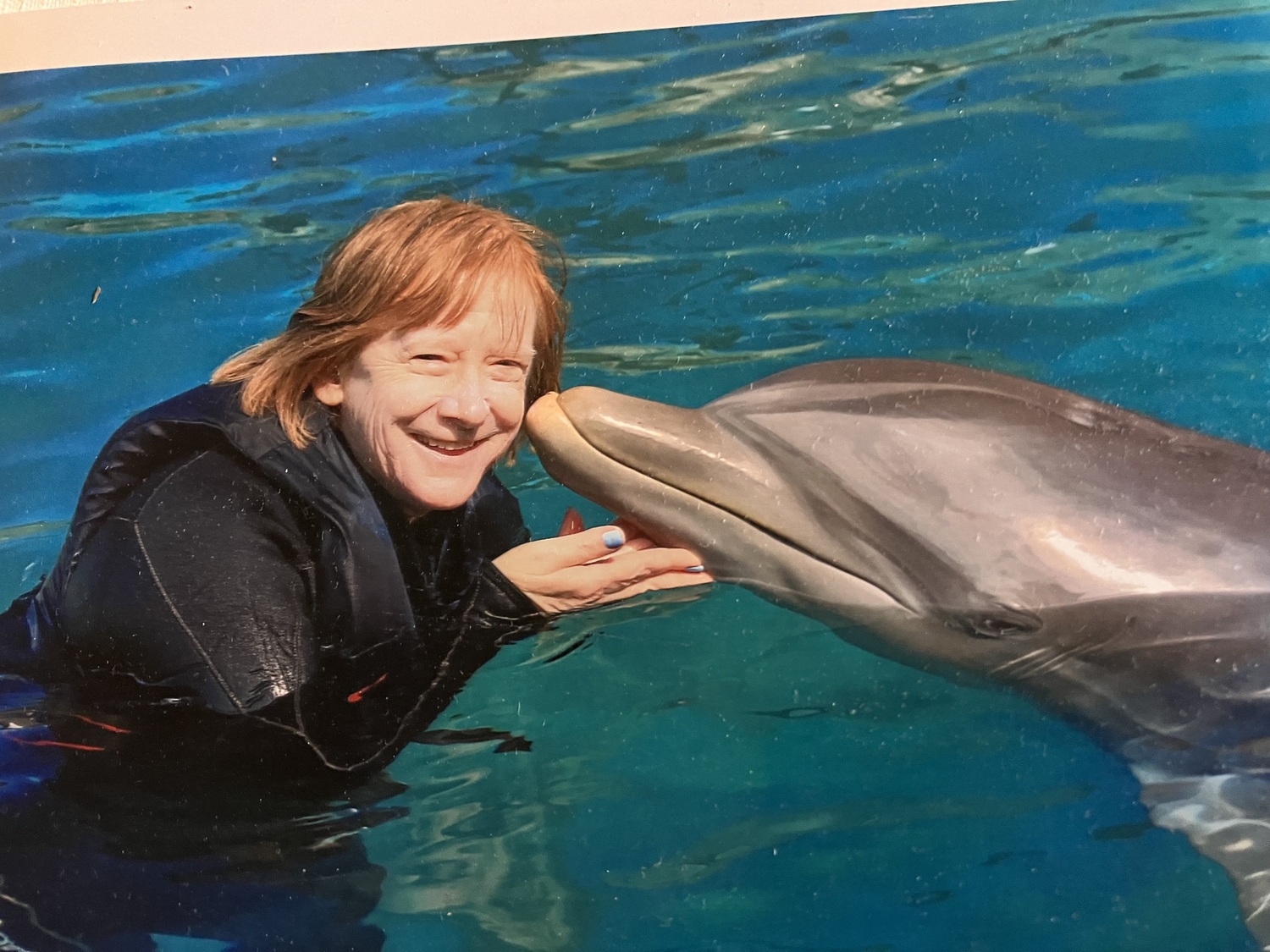 Nancy Bagshaw during a trip to Bermuda, where she was thrilled to swim with dolphins. Nancy was a beloved Spanish teacher in the Bridgehampton School for 17 years. She died last week at the age of 60.