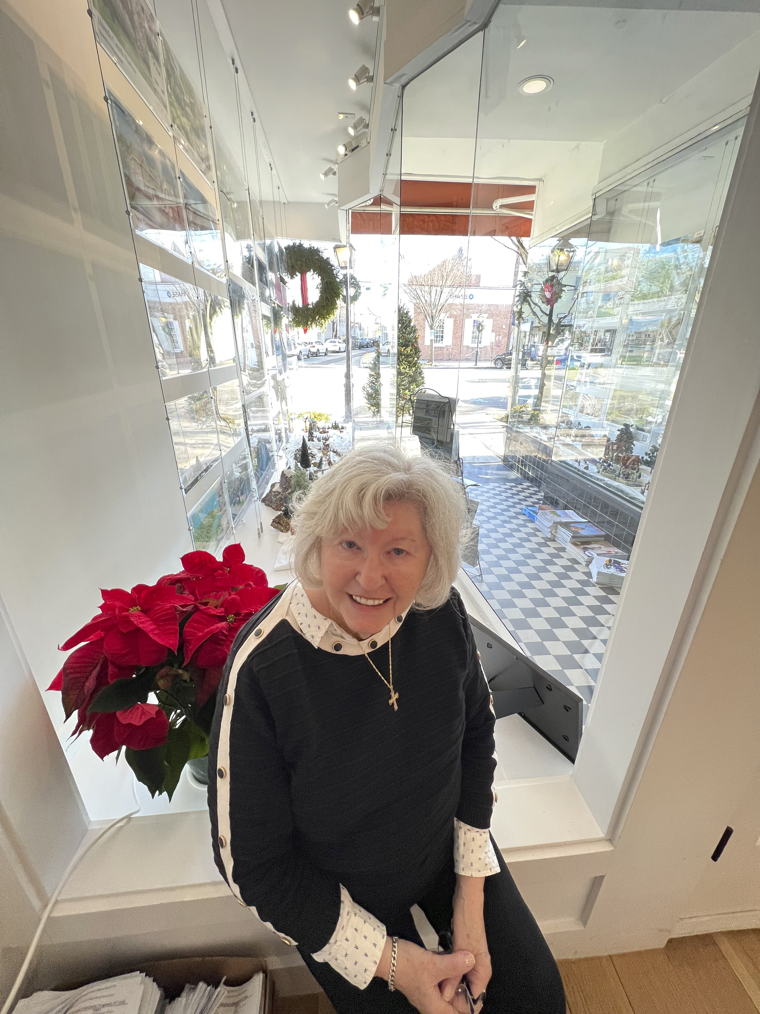 Jane Holden in the Brown Harris Stevens window with some of her collection.  DANA SHAW