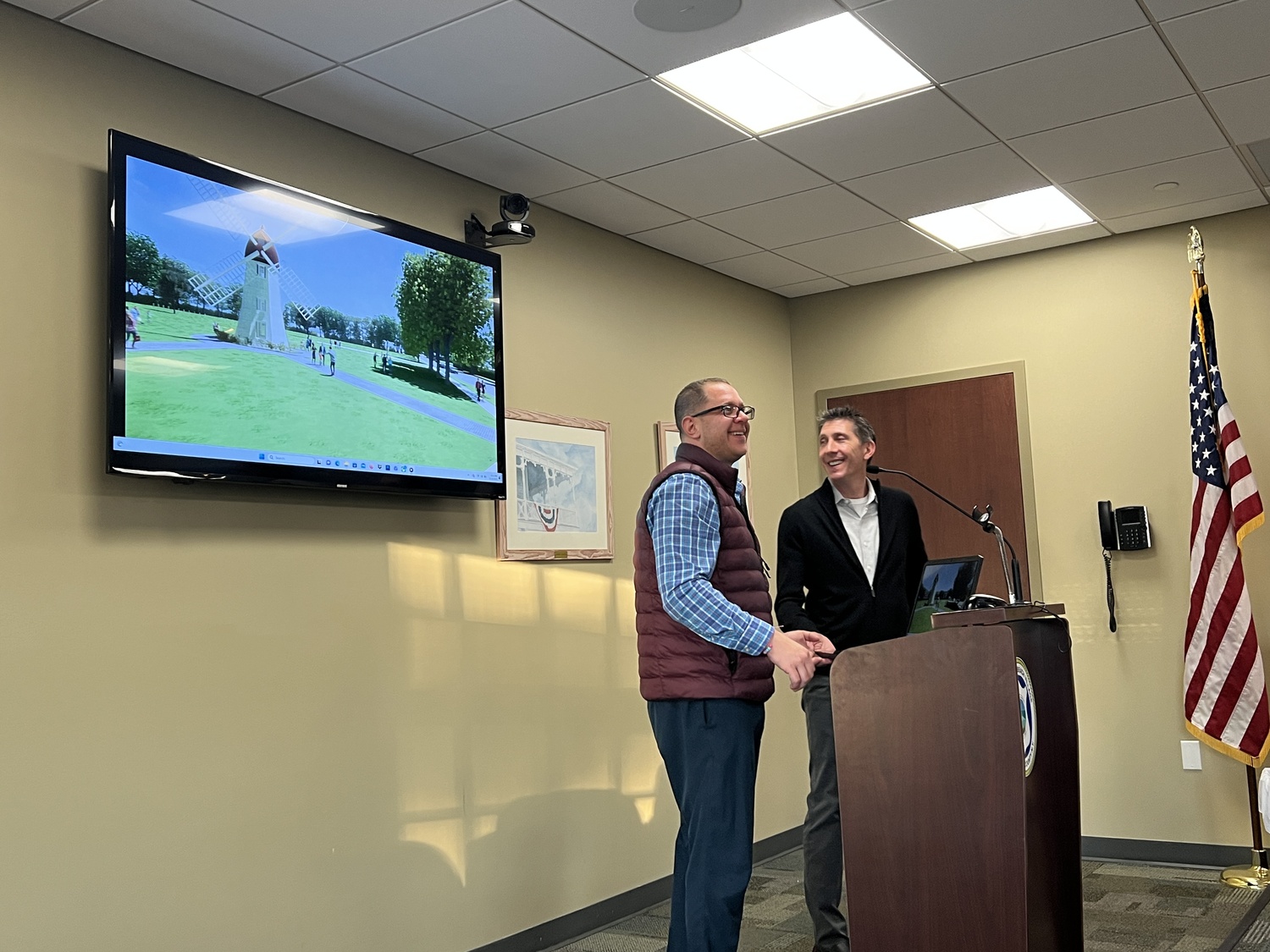 Josh Rosensweig, left, and Craig Arm bring the Westhampton Beach Village Board up to date on the progress of plans to restore the historic Dix Windmill. BILL SUTTON