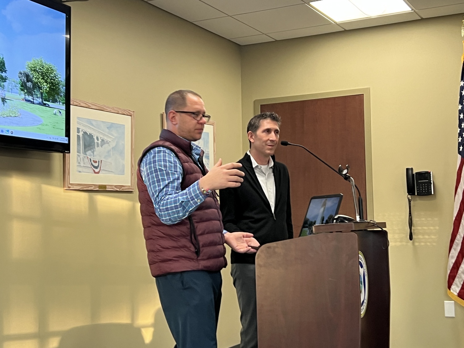 Josh Rosensweig, left, and Craig Arm bring the Westhampton Beach Village Board up to date on the progress of plans to restore the historic Dix Windmill. BILL SUTTON