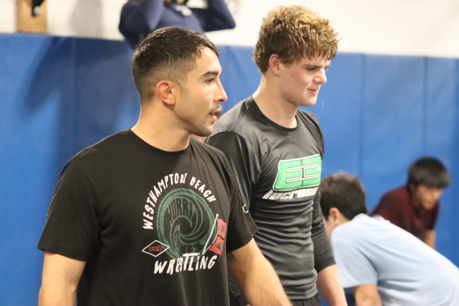 Jakob Restrepo, left, is the new head coach of the Westhampton Beach wrestling team. Restrepo, 26, was a state champion at Sachem East and went on to wrestle at the University of Maryland. CAILIN RILEY