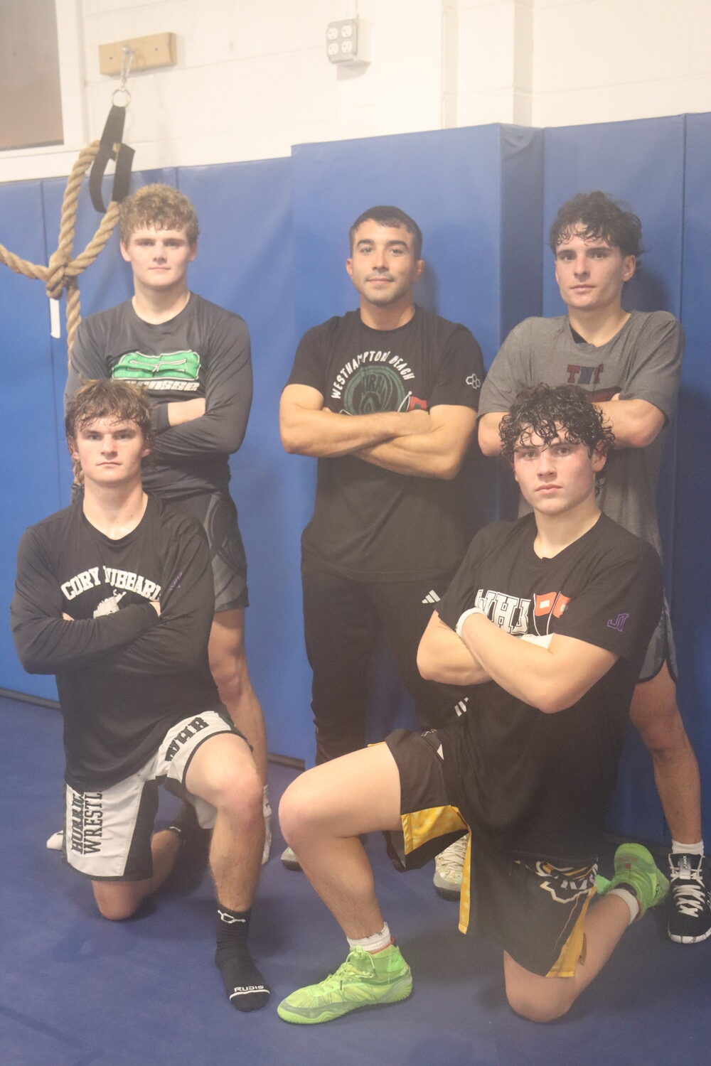 Top row, from left: Connor Rodgers, head coach Jakob Restrepo, and Nate Brandi. Bottom row, from left: Bobby Stabile and Joey Carasiti. The four Hurricanes are this year's captains, and Restrepo, 26, is in his first year as head coach of the team. CAILIN RILEY