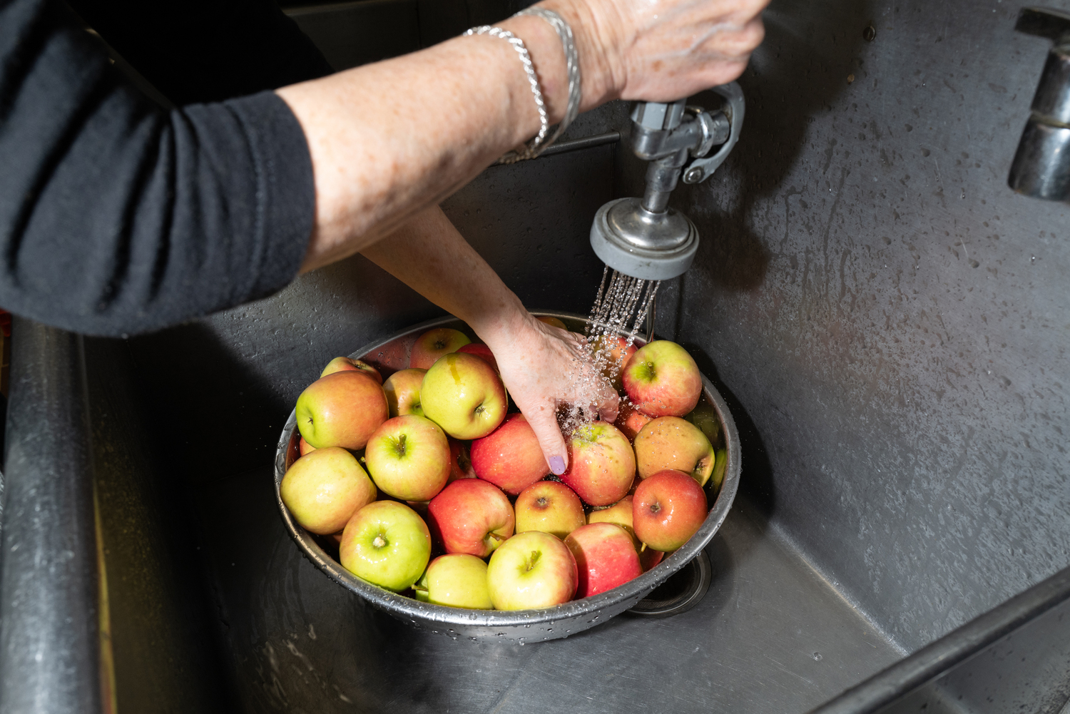 Apples are washed before being peeled. LORI HAWKINS