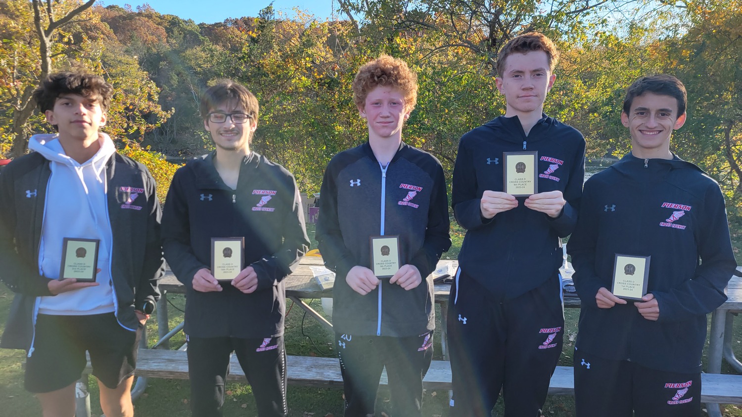 The Pierson boys cross country team placed second, just one point behind Southold. Justin Gardner, far right, was the overall champion.   DREW BUDD