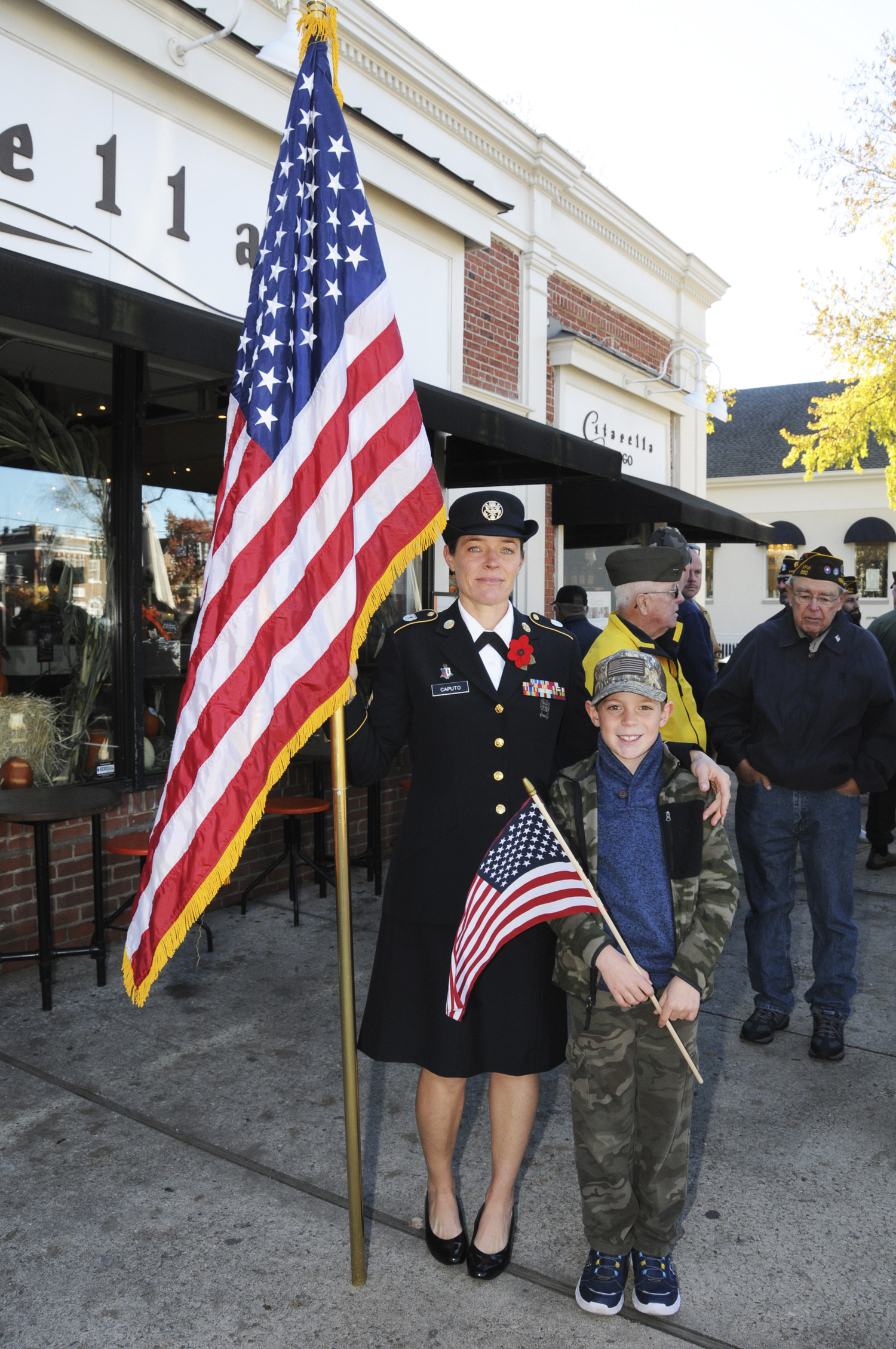 Jeanette Caputo and Sidney Payne at the Veterans Day observance in East Hampton on Saturday.   RICHARD LEWIN