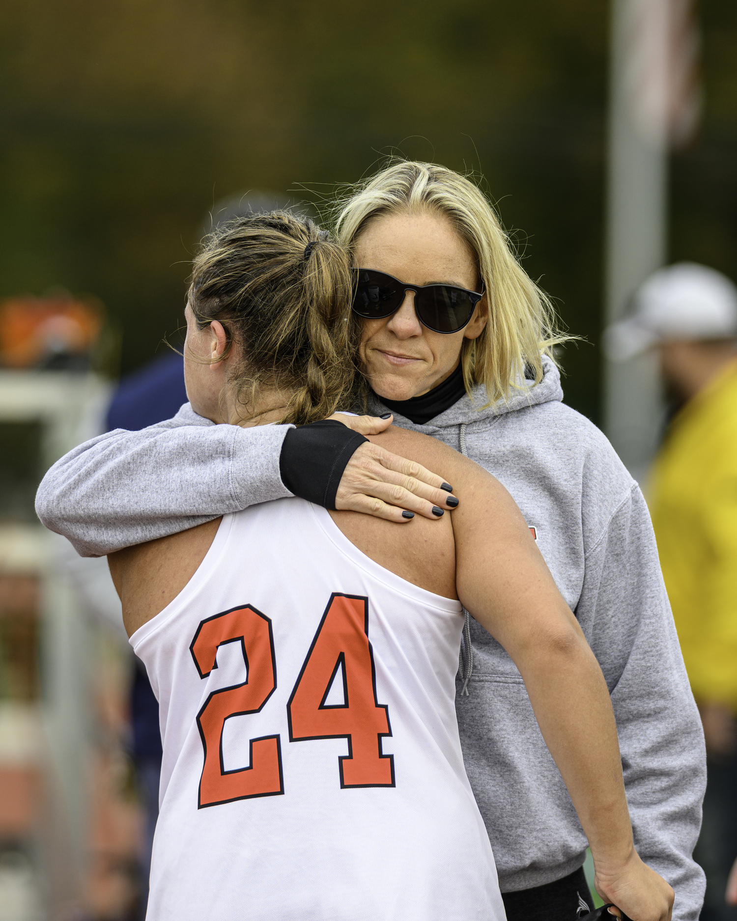 Senior midfielder Lily Perello is embraced by head coach Laura DeSario after the Long Island Championship loss. MARIANNE BARNETT