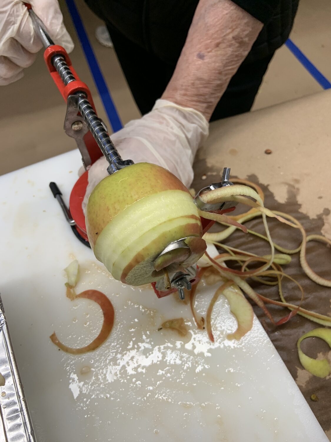 The apple peeler in operation. STEPHEN J. KOTZ