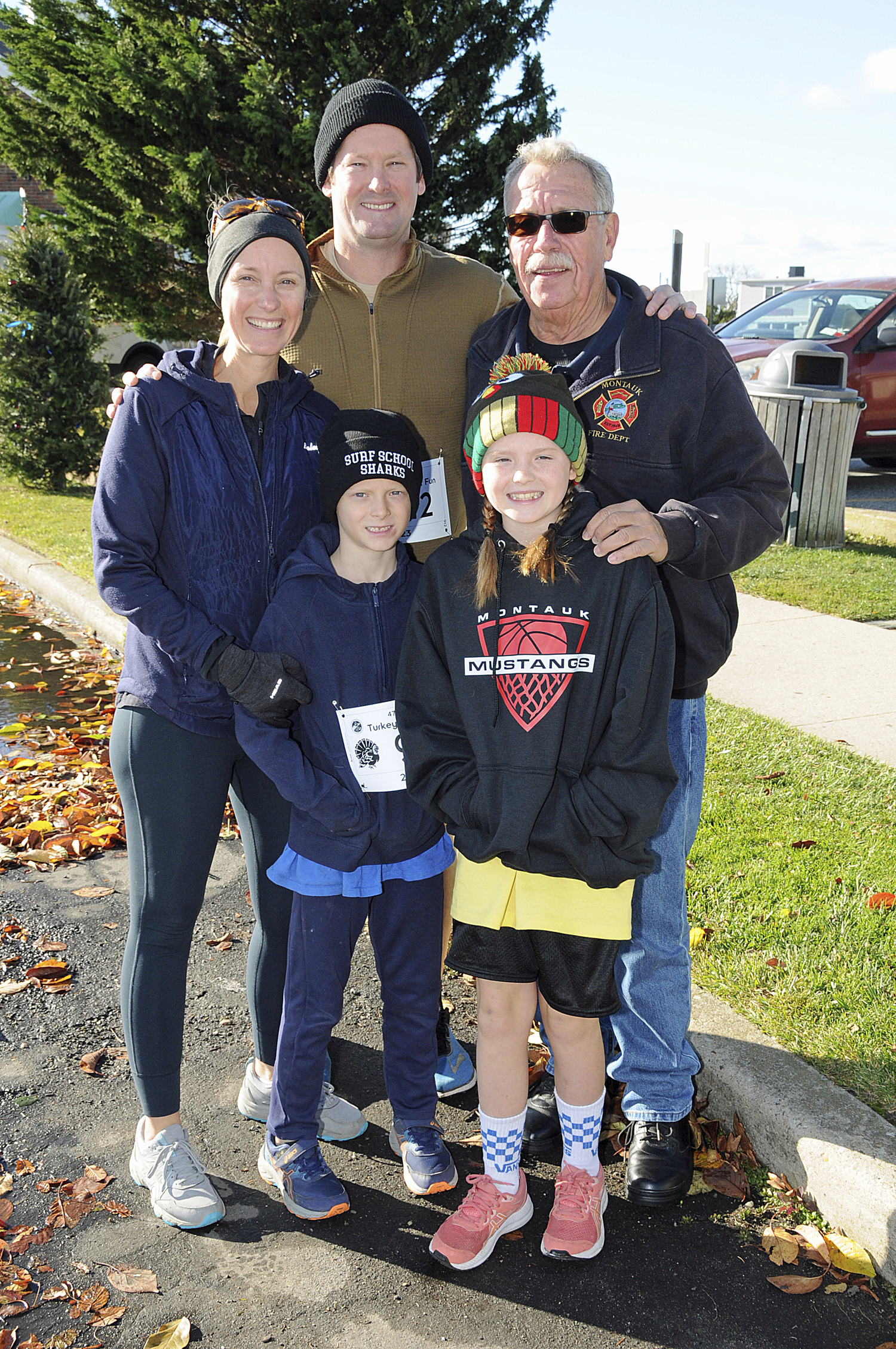 Kari and Denis Shea, Eddie Ecker and Ronan and Maggie Shea at the 47th annual Turkey Run For Fun in Montauk on Thanksgiving Day.   RICHARD LEWIN