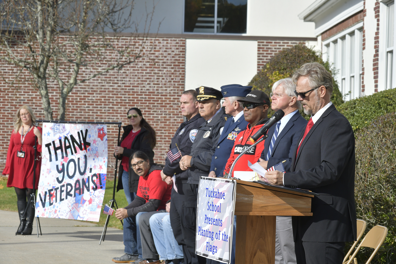 Tuckahoe School Superintendent Leonard Skuggevik welcomes the crowd to the first ever Field of Flags event honoring veterans on November 8.    DANA SHAW