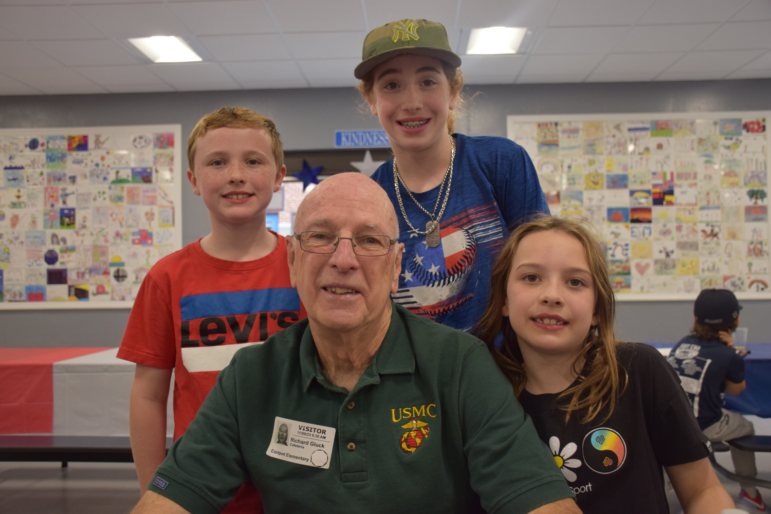Veteran Richard Gluck attended the Eastport Elementary School Veterans Day breakfast
with his grandchildren Claire Willsey, right, and, back Nick Gluck and Evelyn Gluck. COURTESY EASTPORT-SOUTH MANOR SCHOOL DISTRICT