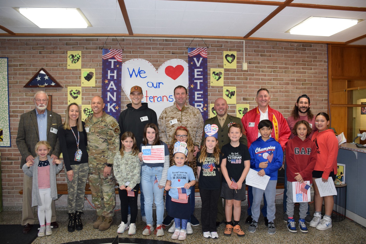 Westhampton Beach Elementary School paid tribute to local veterans on November 9, during which students learned about the history of
Veterans Day, met 14 local veterans from all branches of the military and heard from guest
speaker Sr. Master Sgt. Jonathan Mazura. To culminate the ceremony, students sang “Proud
of Our Veterans.” Additionally, in honoring local veterans for Veterans Day, Westhampton Beach High School students in U.S. history classes met with and heard from members of the VFW Post 5350. The veterans spoke to the students about their respective careers in the military. COURTESY WESTHAMPTON BEACH SCHOOL DISTRICT