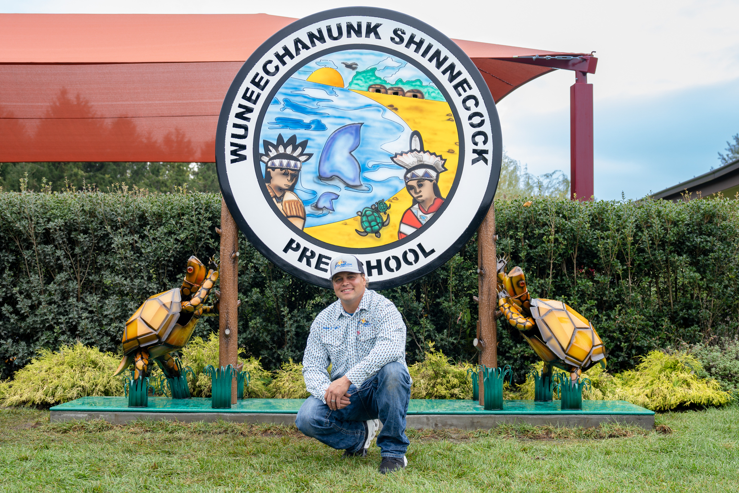 Gordon Smith recently installed a new sign that he made for the Wuneechanunk Shinnecock Preschool. REBEKAH WISE