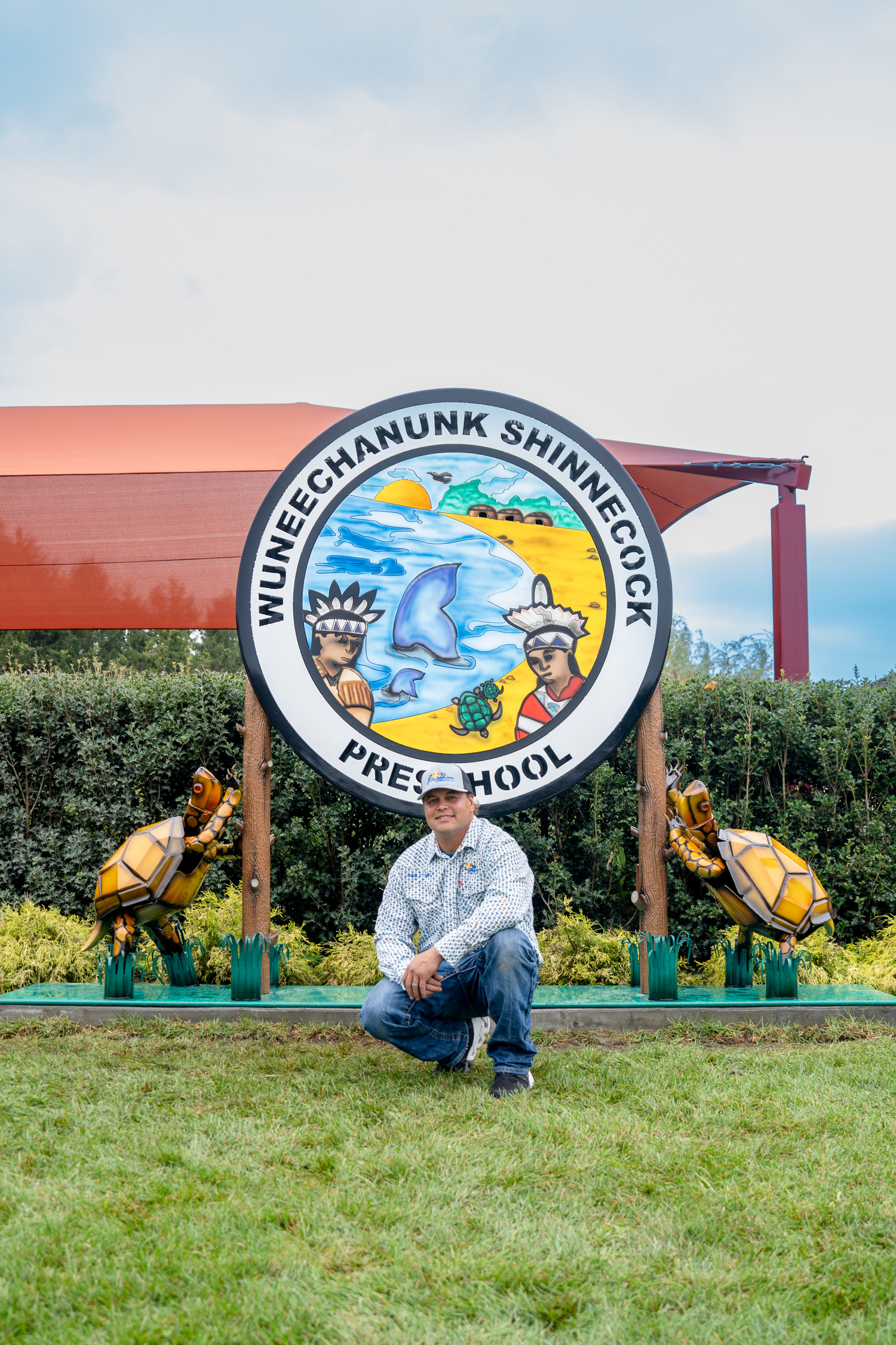 Gordon Smith recently installed a new sign that he made for the Wuneechanunk Shinnecock Preschool. REBEKAH WISE