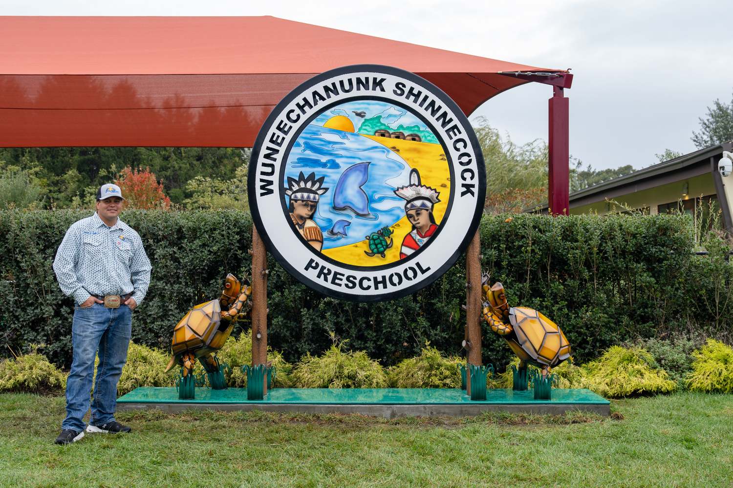 Gordon Smith recently installed a new sign that he made for the Wuneechanunk Shinnecock Preschool. REBEKAH WISE