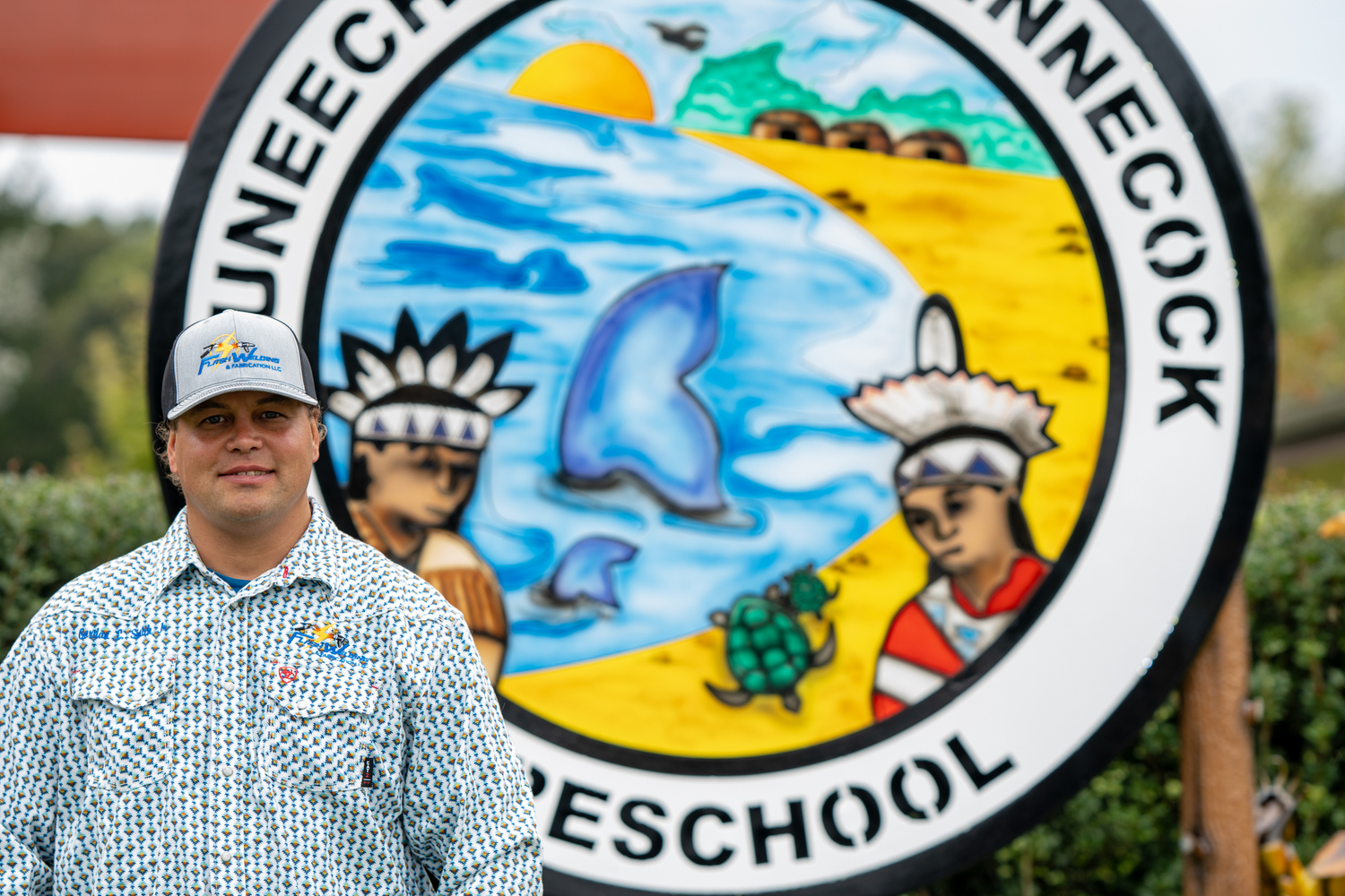 Gordon Smith recently installed a new sign that he made for the Wuneechanunk Shinnecock Preschool. REBEKAH WISE