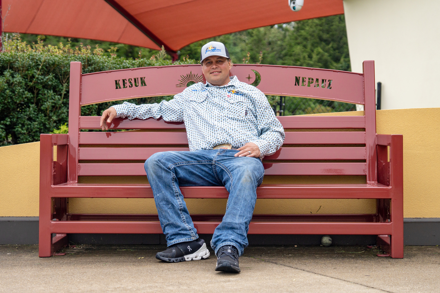 Gordon Smith sits on a bench that he designed and welded for the Wuneechanunk Shinnecock Preschool. REBEKAH WISE