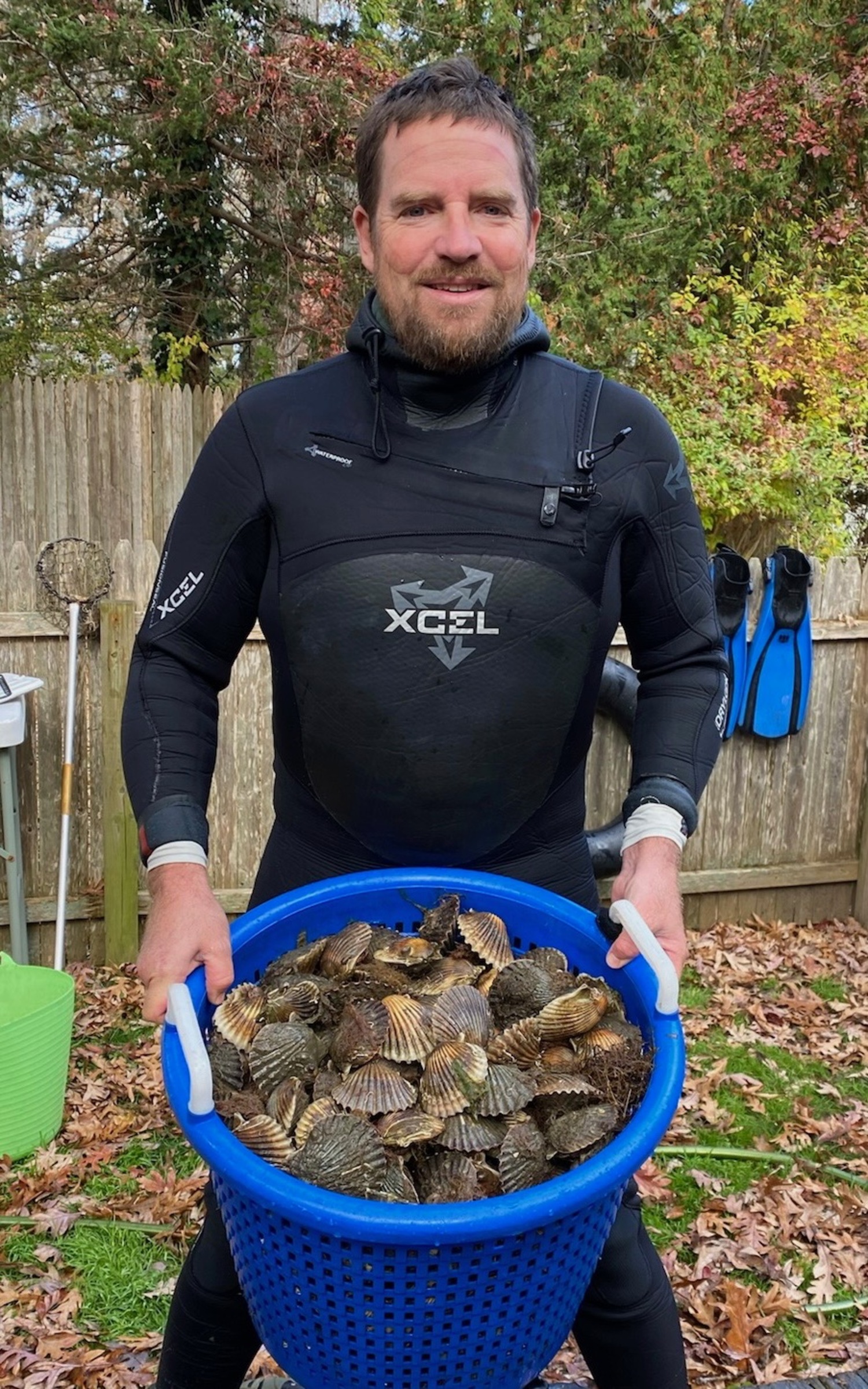 Pete Topping with a bushel of scallops he collected on Monday morning in Southampton.