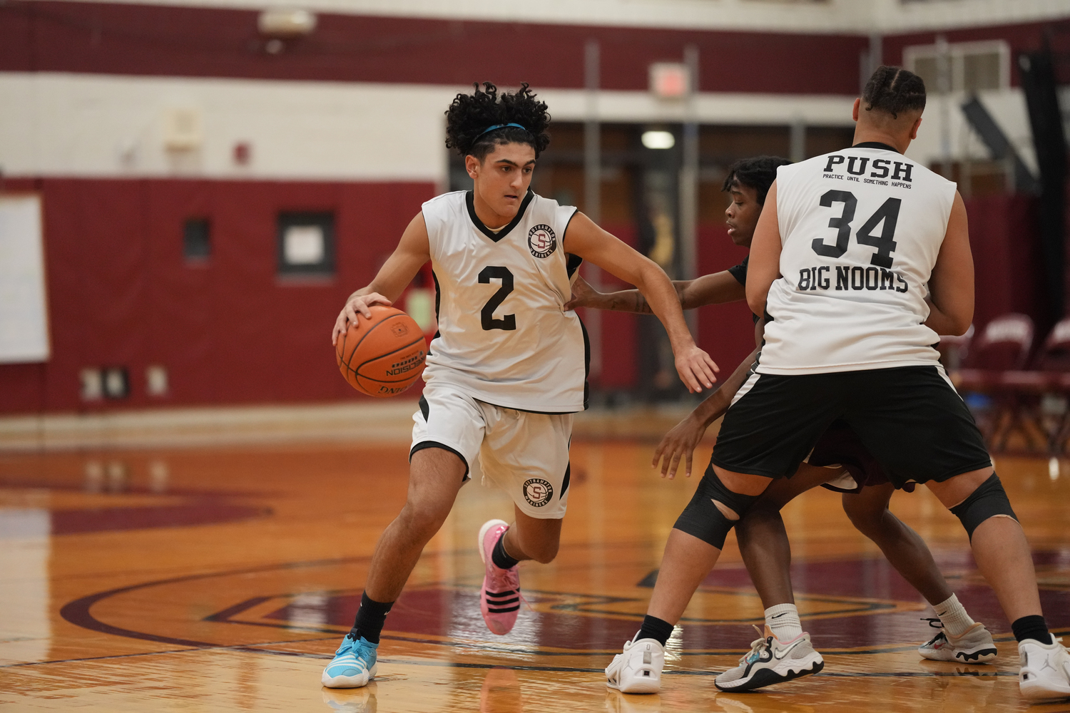 Alex Franklin dribbles around a pick set by Noomie Williams.   RON ESPOSITO