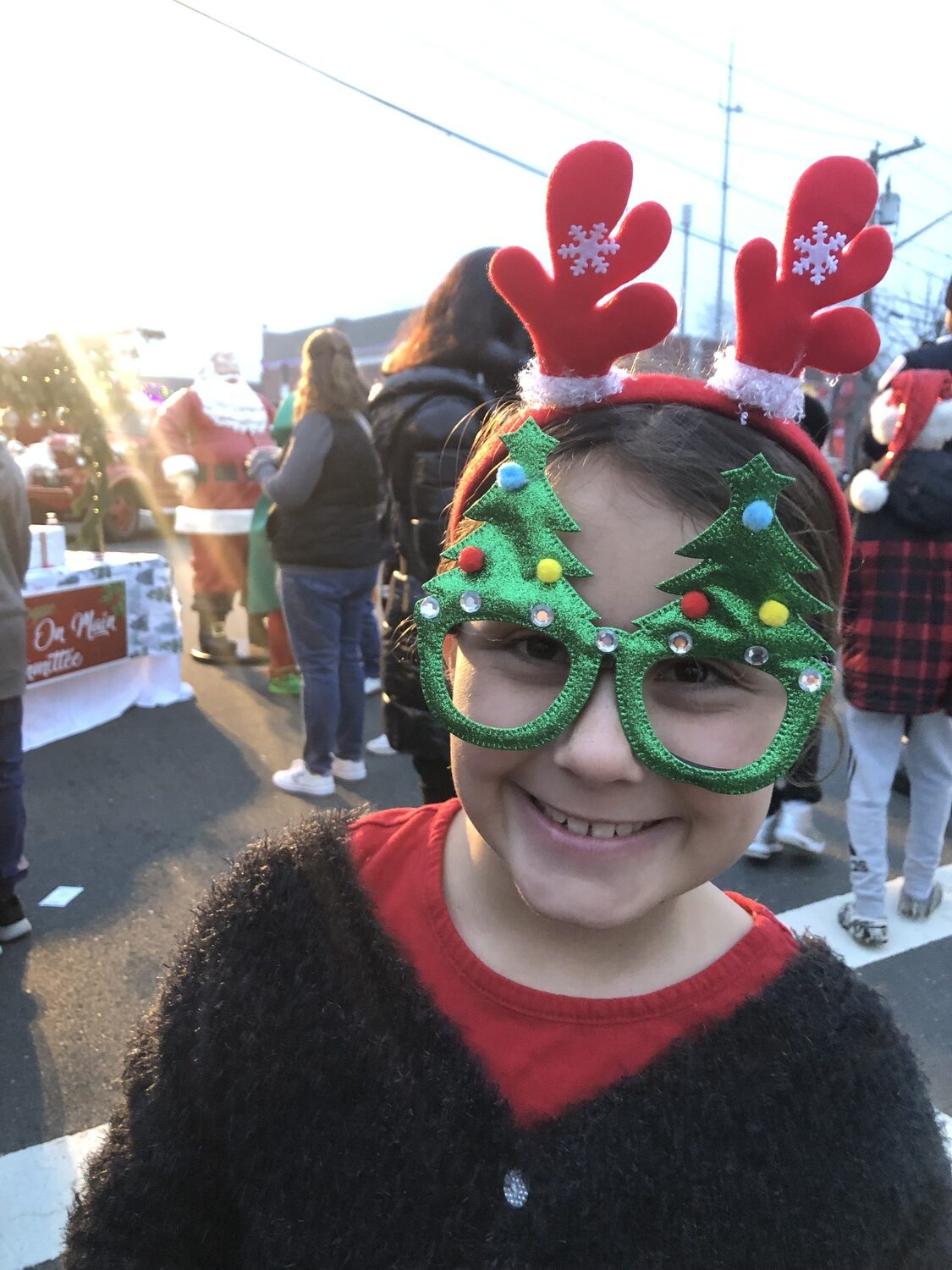 Claire Riley gets into the spirit at the second annual “Holiday on Main” event in East Quogue on Saturday.  CAILIN RILEY