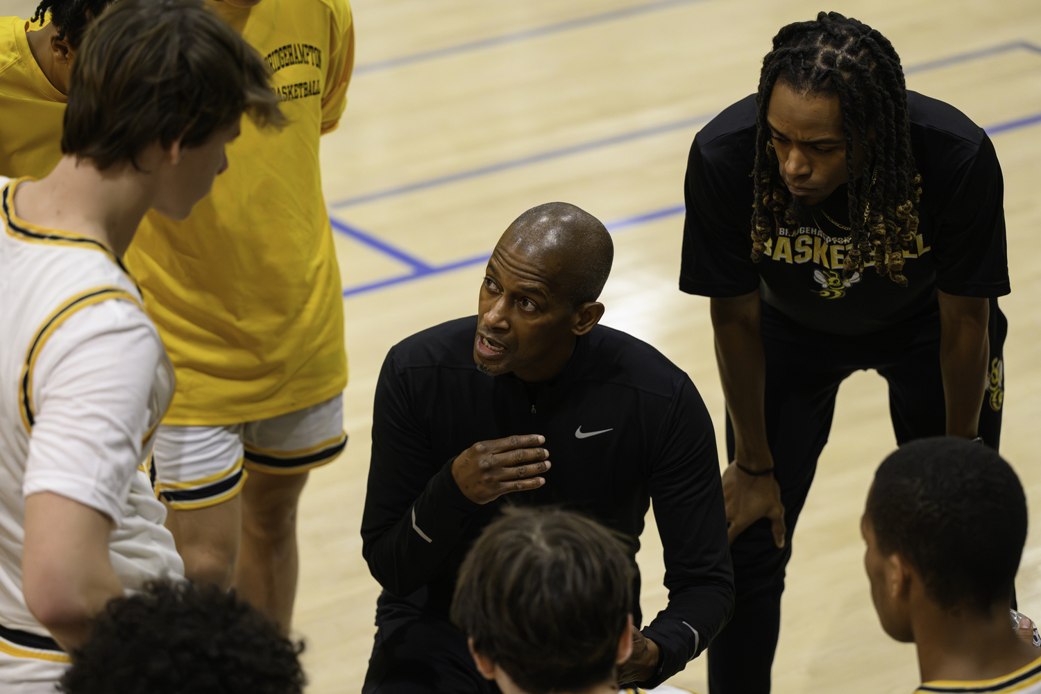 Carl Johnson talks to his players during a timeout.   MARIANNE BARNETT