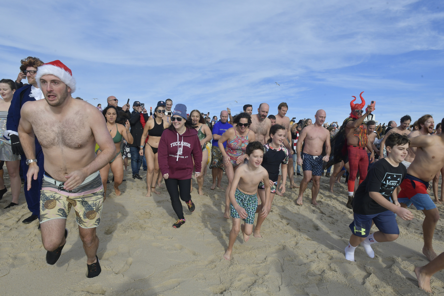 Plungers head into the water.