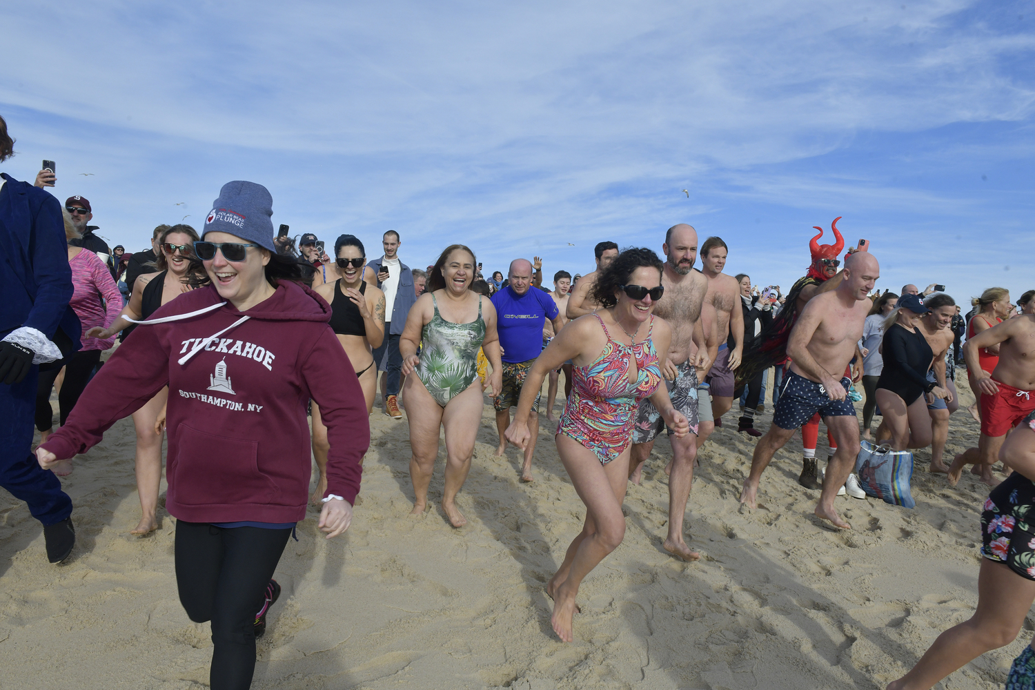 Plungers head into the water.