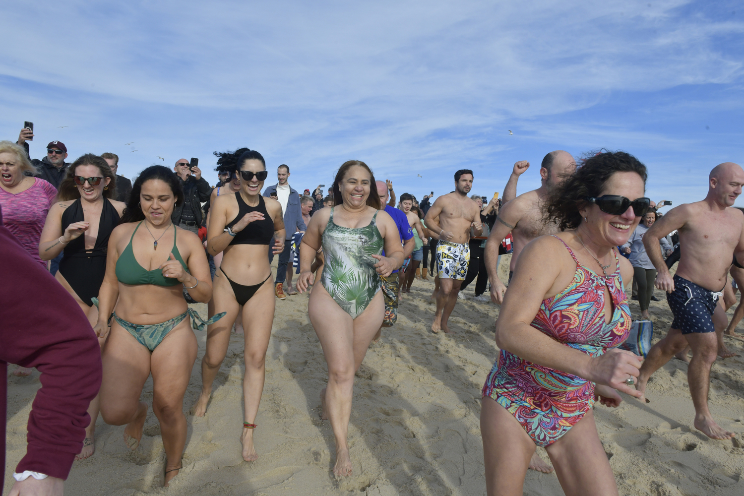 Plungers head into the water.