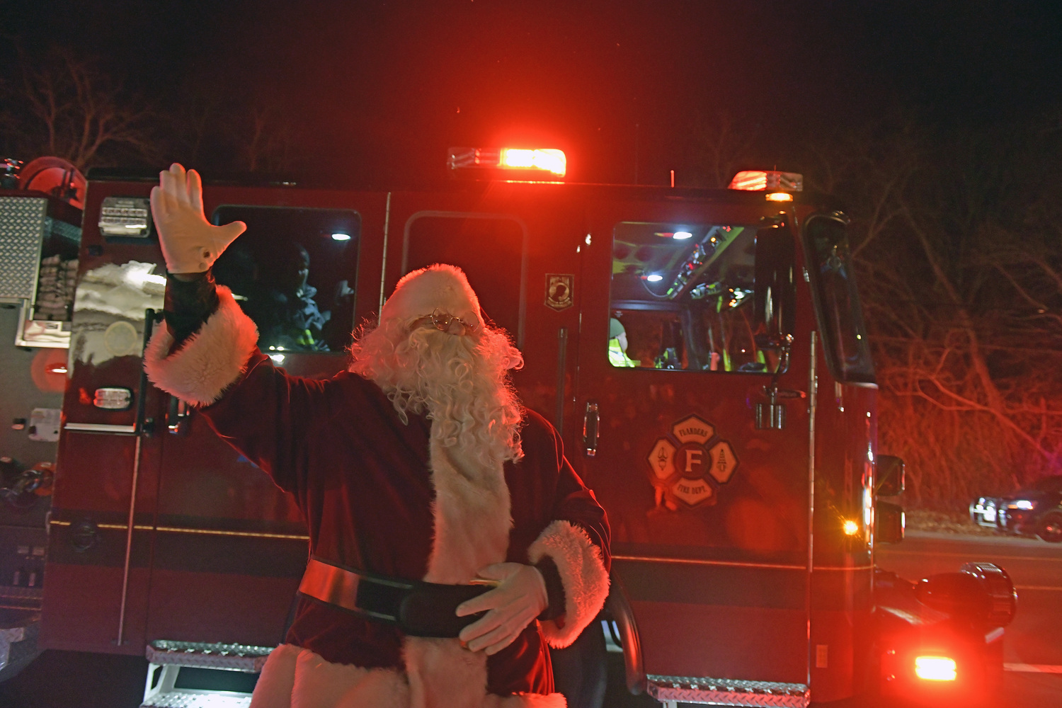 Santa arrives at the Big Duck lighting via the Flanders Fire Department on Novemeber 29.    DANA SHAW