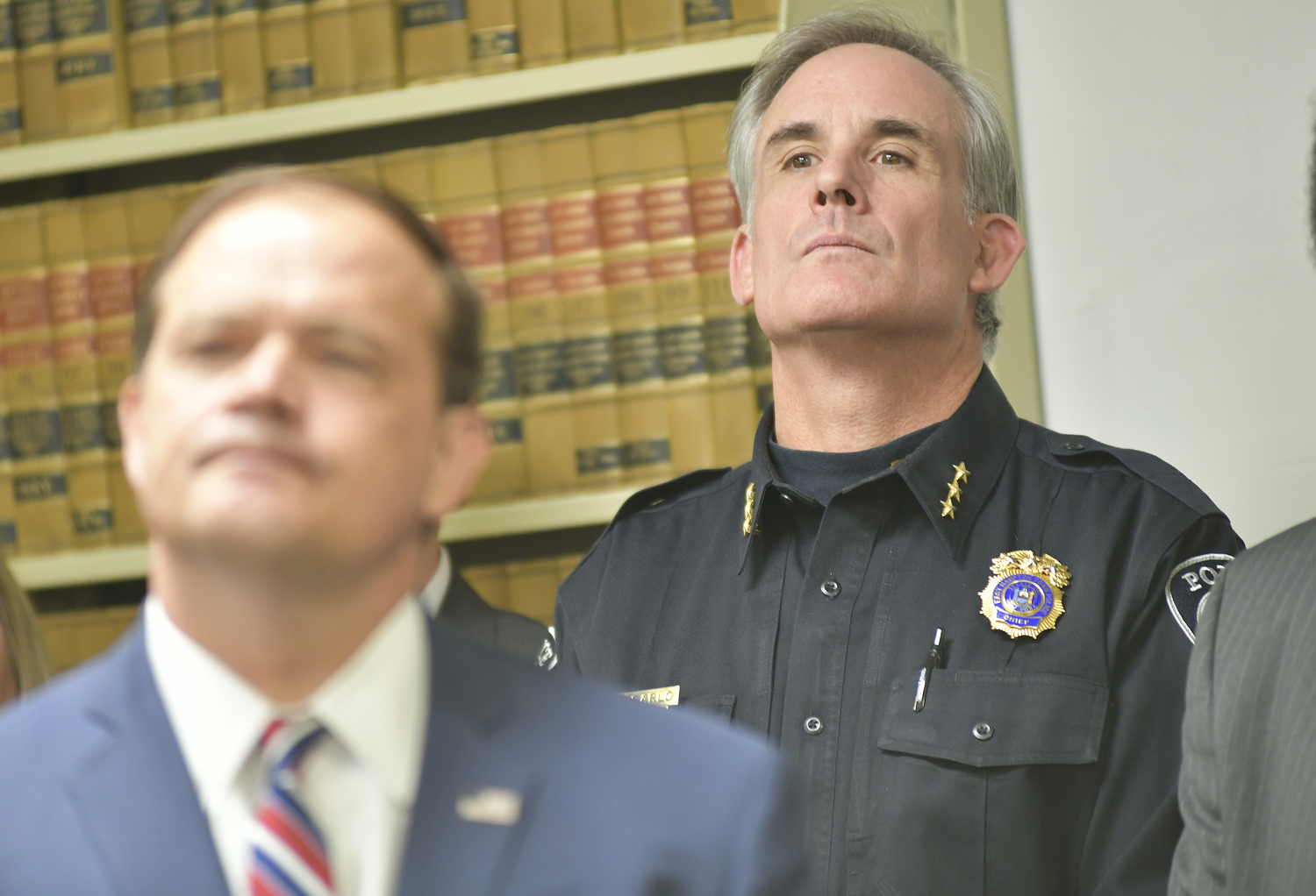 East Hampton Town Police Chief Michael Sarlo at a press conference in Riverhead where District Attorney Ray Tierney, foreground, announces an arrest in the Montauk hate crime graffiti investigation.  DANA SHAW