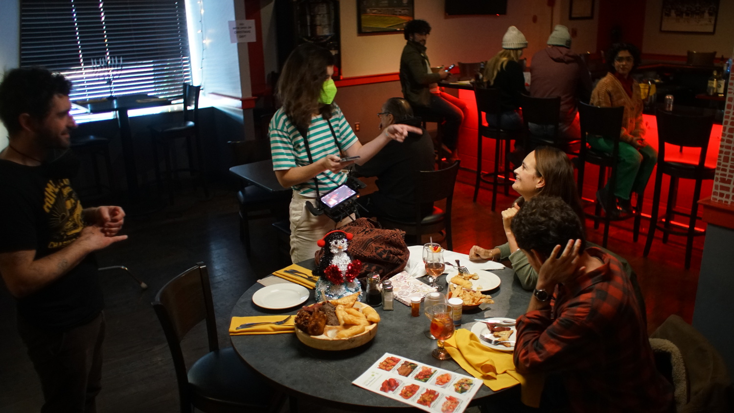 Directors Dan Kennedy and Caroline Keene work with Sawyer Spielberg and Raye Levine in a Chinese restaurant scene in the film 