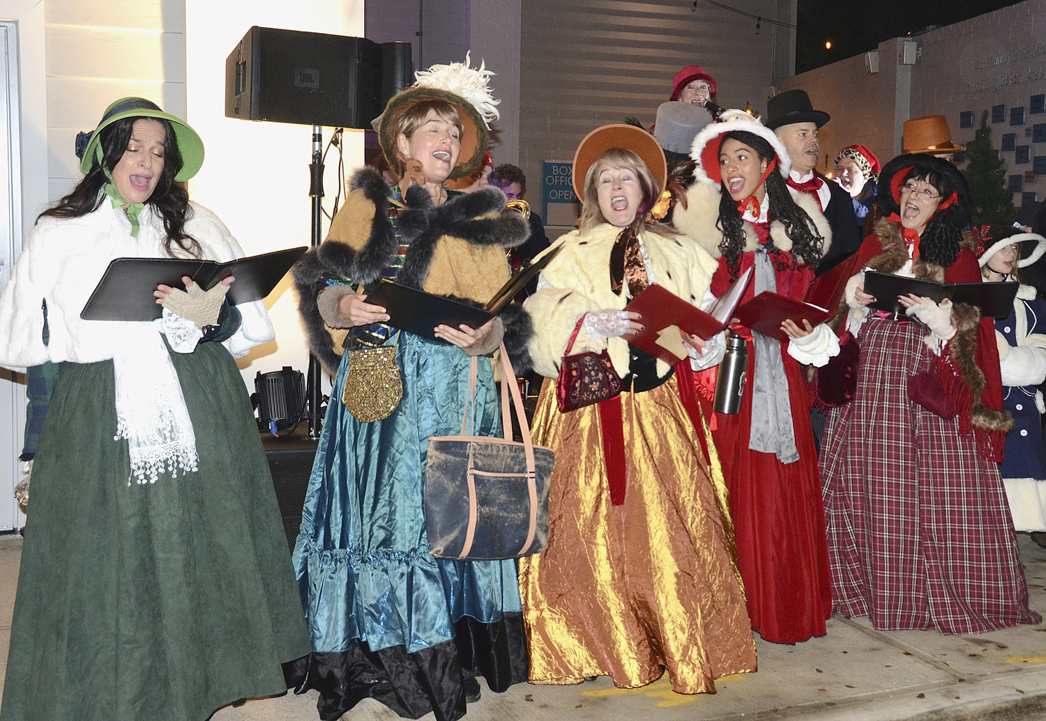 the Dickens Carolers perform at 