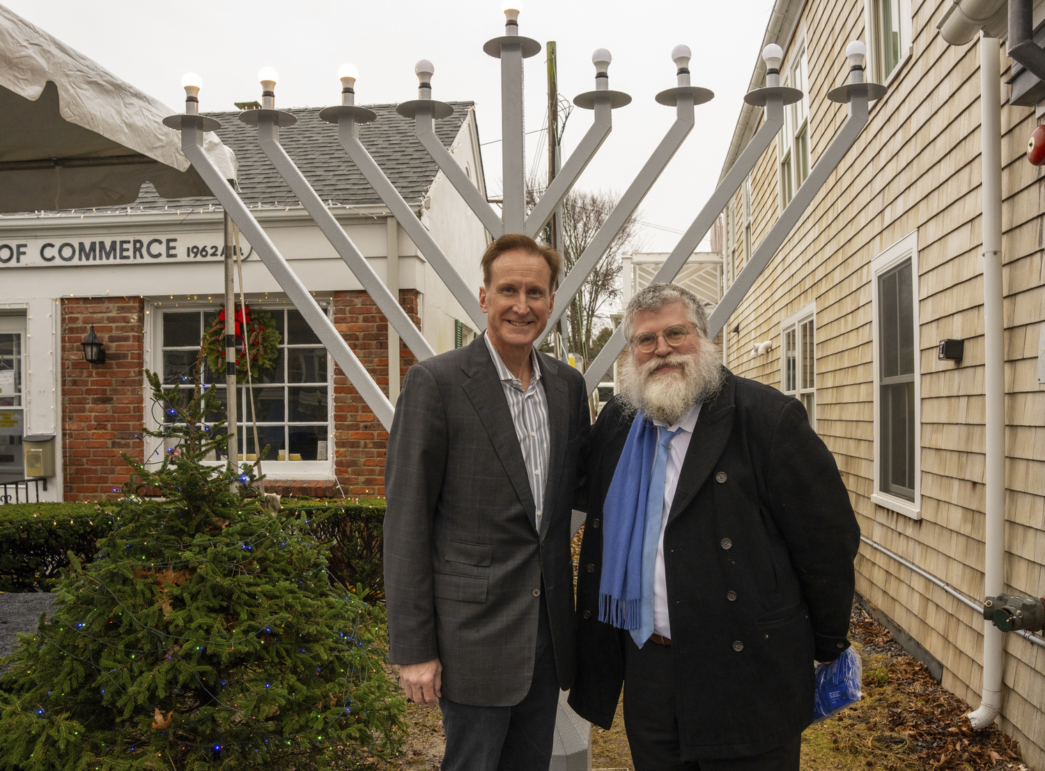 Southampton Village Mayor Bill Manger and Rabbi Rafe Konikov of Chabad of Southampton Jewish Center at the lighting of the menorah at the Southampton Chamber of Commerce on Sunday.  RON ESPOSITO