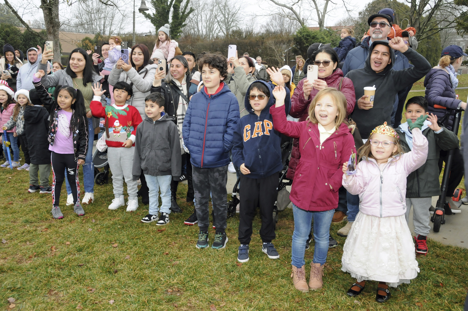 Children react to Santa's arrival in Herrick Park in East Hampton on Saturday.   RICHARD LEWIN