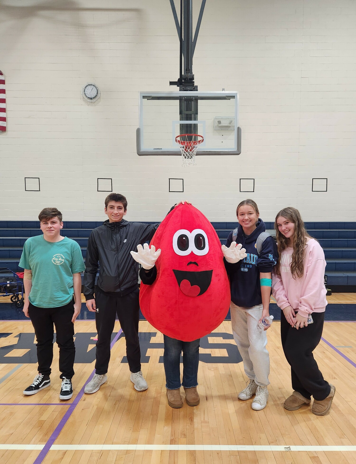 Eastport-South Manor Jr.-Sr. High School members of the National Honor Society Vlad Curticapean, Jaden Flood, Mrs. Andersen, Kate Keese, Casey DaSilva with the New York Blood Center mascot during the November 15 blood drive. COURTESY EASTPORT-SOUTH MANOR SCHOOL DISTRICT