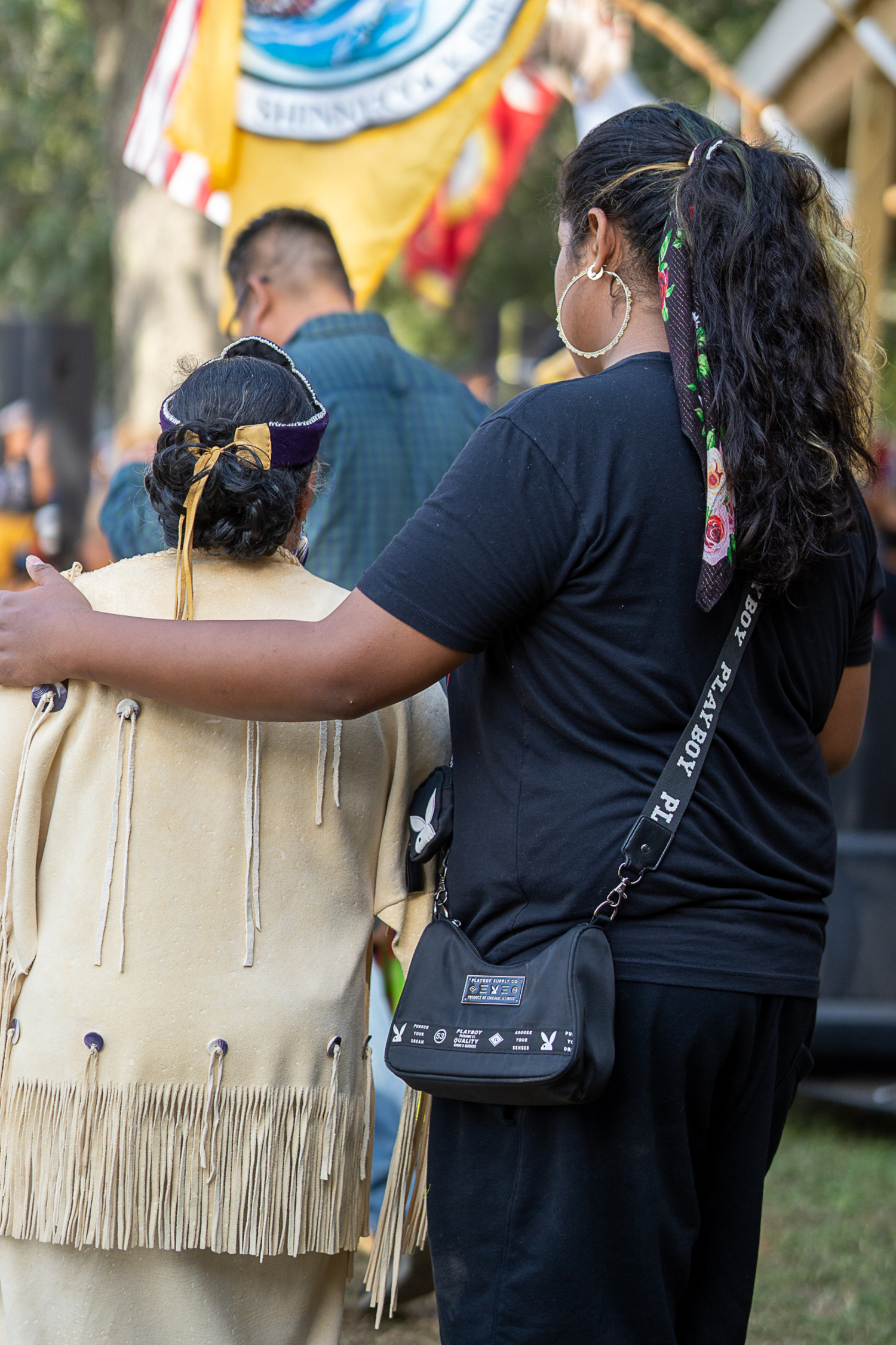 Eli Phillips escorts his grandmother, Linda Franklin, who is the Sunksqua of the Shinnecock Nation, to Grand Entry, which she led with the other tribal trustees. REBEKAH PHOENIX WISE