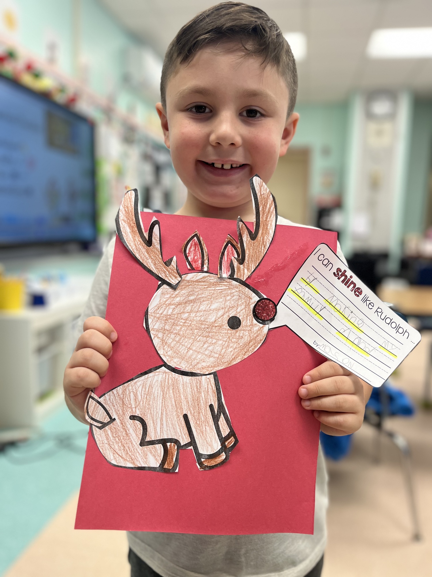 Mason Smith was among the Hampton Bays Elementary School second grade students in Erin McDermott’s class who kicked off the holiday season with a lesson about kindness. The students brainstormed ways to spread kindness during the holiday season and then wrote creative writing pieces about how kindness can shine a bright light, much like Rudolph's shiny red nose.  COURTESY HAMPTON BAYS SCHOOL DISTRICT